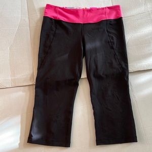 NWOT. Lululemon vintage black & pink crop pants with split in back. Size 12